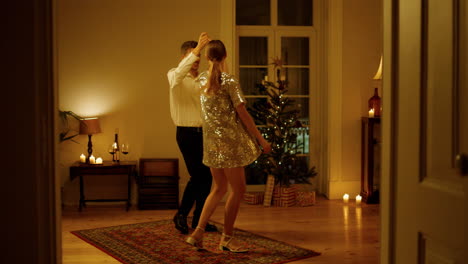 sensual couple dancing christmas eve room. tender lovers bonding xmas tree place