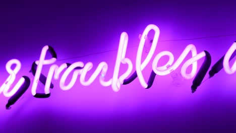 word troubles in neon sign 4k