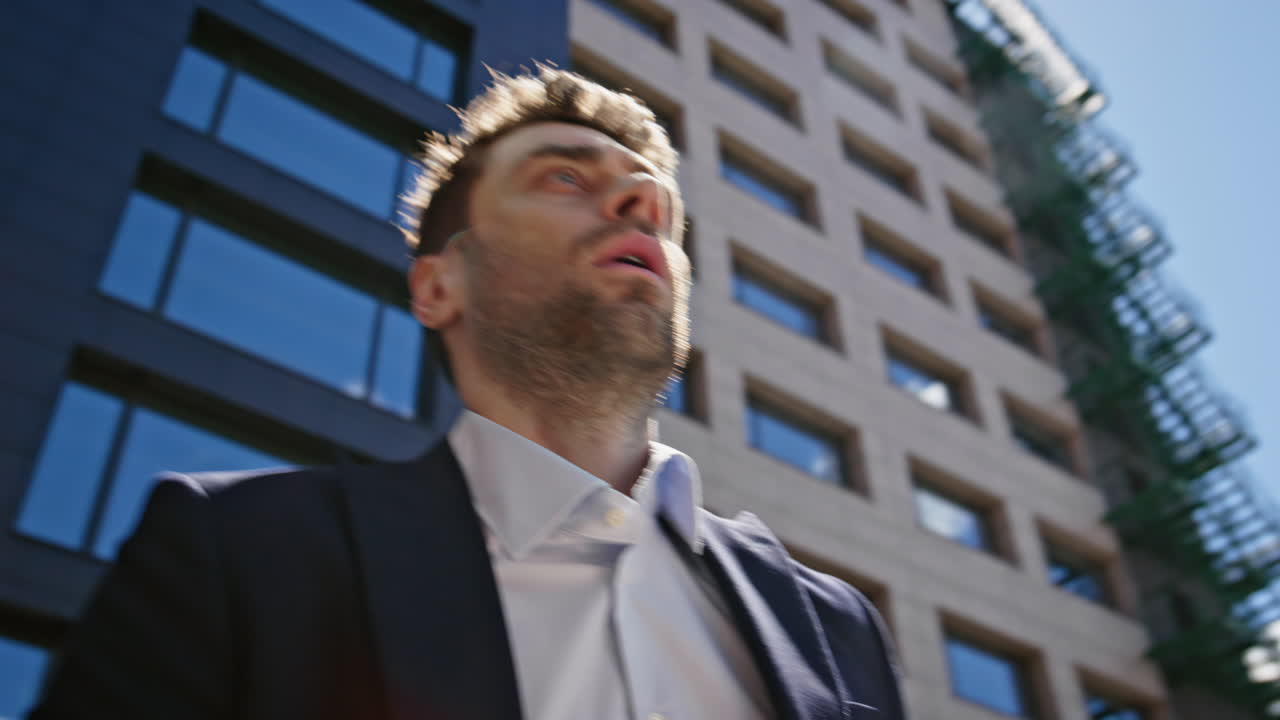 Frustrated manager analysing documents standing business street closeup