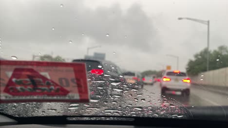 sitting in traffic on a rainy day with the windshield wipers on