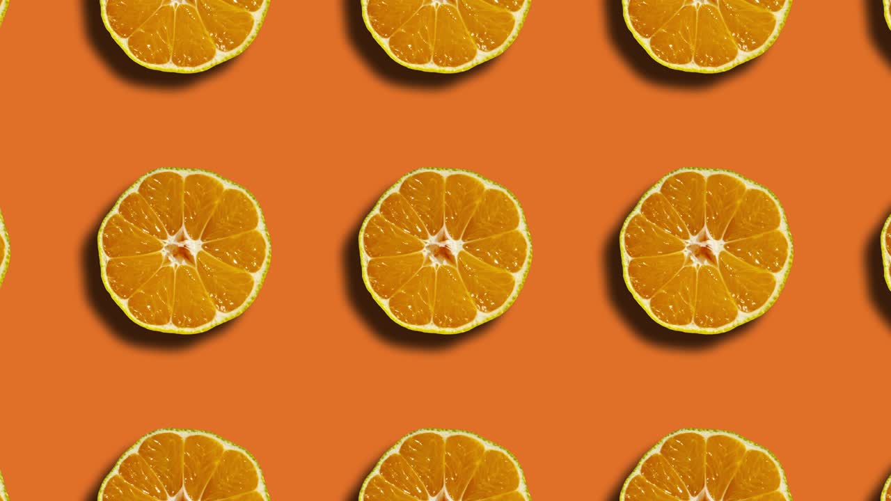 patrón mandarín en cuadrícula geométrica en un fondo naranja. gráficos de movimiento en bucle simple animación de frutas naturales