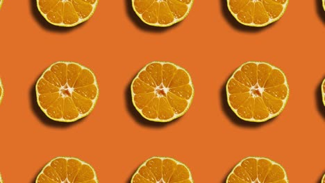 mandarin pattern in geometric grid on an orange background. simple looped motion graphics natural fruit animation