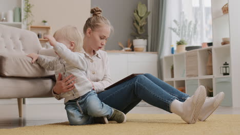 toddler climbing on sofa away from mother