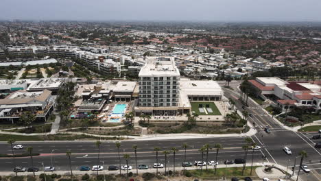 clockwise aerial parallax around apartment, intersection, huntington beach, california