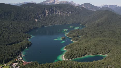 scenic landscape of rural village side lake in a wonderful summer season day time inside pine tree forest nature traveler plan trip to hiking and outdoor leisure mountain eibsee bayern deutschland