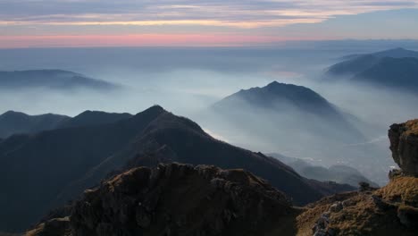 Resegone-mountain-range-at-sunset-on-foggy-day,-Northern-Italy