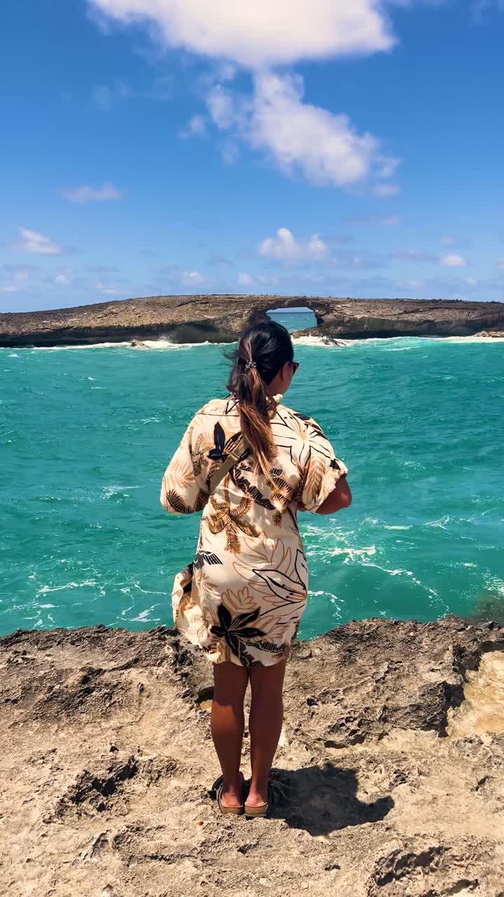 Asian woman on Oahu gazing at Lāʻie Point's ocean view