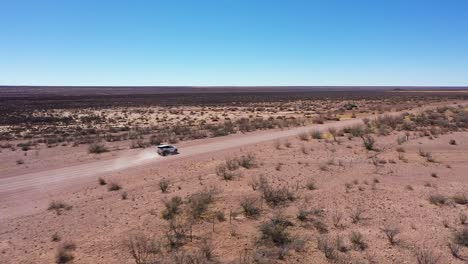 A-4x4-safari-car-drives-over-a-long-road-in-Namibia