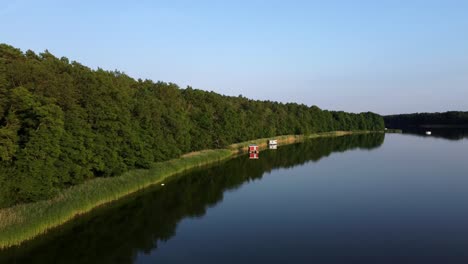 several house boats floating on a lake in brandenburg, germany