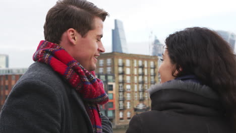 young tourist couple visiting london in winter