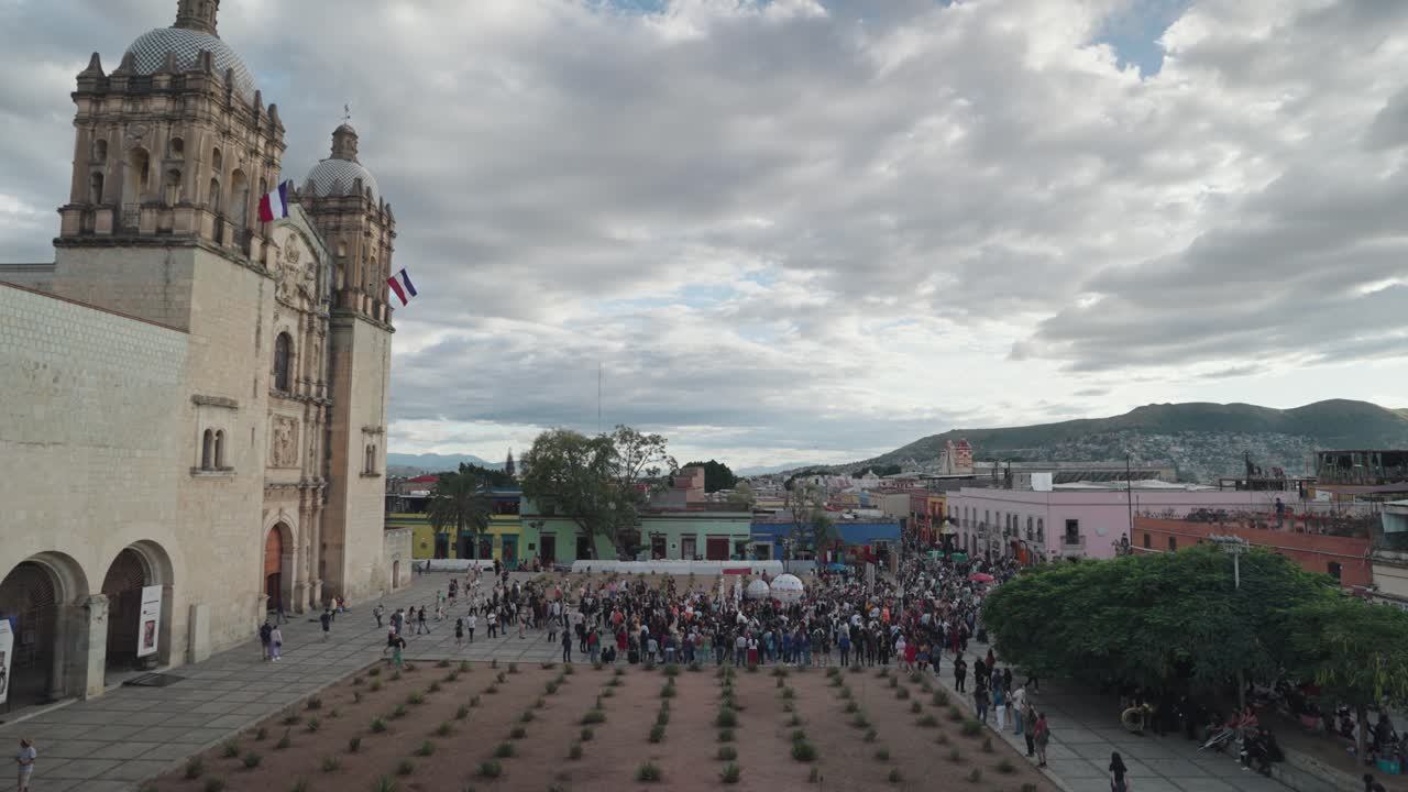 A beautiful church and crowd in a historic city