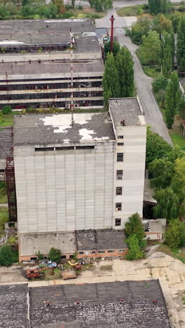 exterior of industrial destroyed buildings. destroyed aerial view of huge territory factory. vertical video
