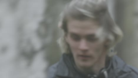 man walking in a foggy forest