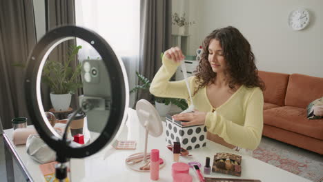 Female Blogger Unboxing Beauty Items, Recording Review with Phone and Ring Light