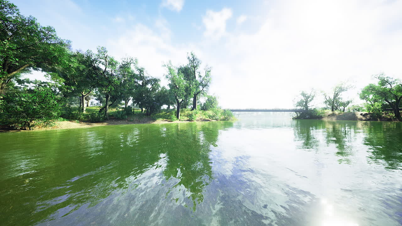 Serenity of a tranquil riverside landscape under a clear blue sky