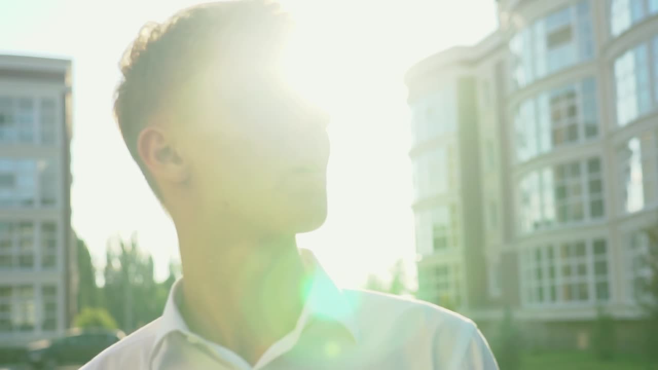 Young Man in City Sunlight