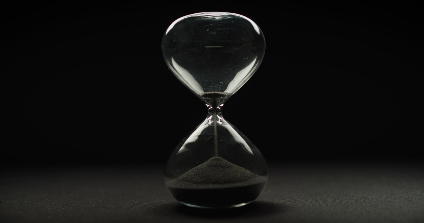Hour glass with black sand