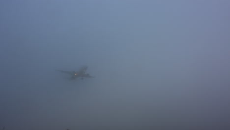 airplane landing in thick fog