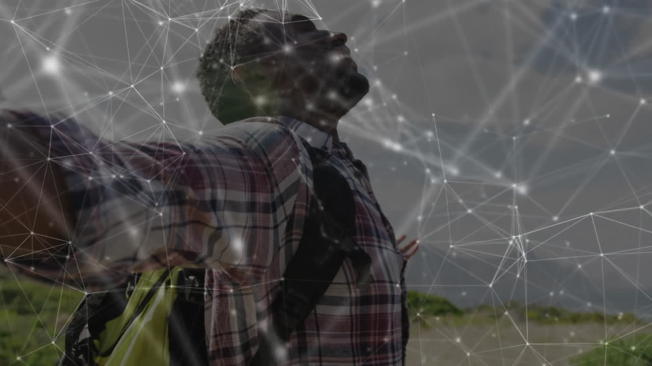 Man standing on rural dirt road, with digital network overlay connecting nodes, highlighting tech