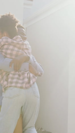 video of happy african american couple embracing in front of new house