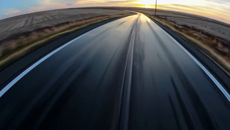 sunset drive on a wet country road