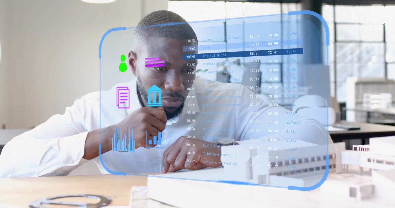 Architect leaning over building model in office pinching holographic charts customizing display