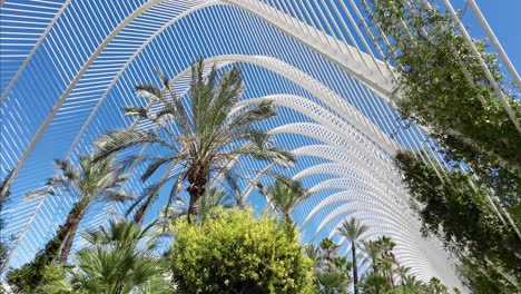 a tropical mediterranean looking park with a modern architecture in a spanish town