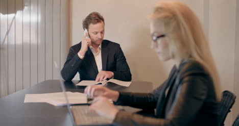 business people working at table in boardroom