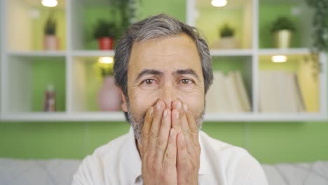 Close-up-mature-man-looking-at-camera-getting-bad-news.