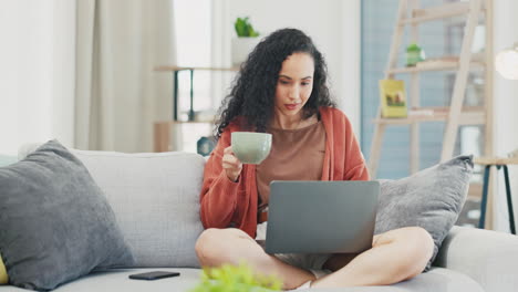 Woman,-coffee-and-laptop-on-sofa-in-living-room