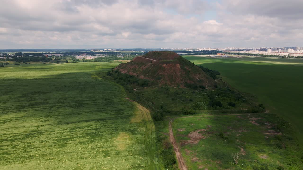 Household waste landfill. Closed for processing. Environment protection. Shooting closer to the subject. Aerial photography