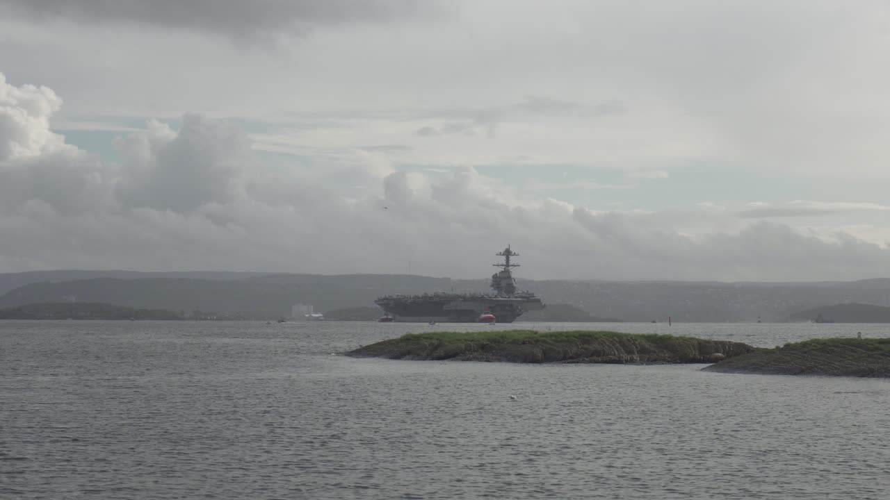 USS Gerald R. Ford Aircraft Carrier, Lead Ship Arriving In The Coast Of Oslo In Norway. - wide shot