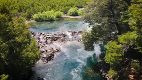 Aerial-flyover-paradise-on-earth-showing-hidden-lake-surrounded-by-green-nature-in-Patagonia,-Argentina