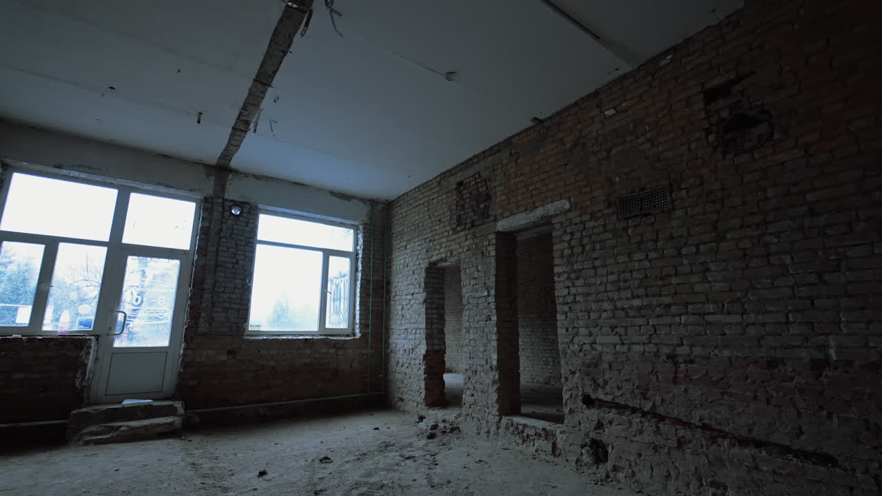 Brick walls with doorways in them. Construction or reconstruction of a big building.