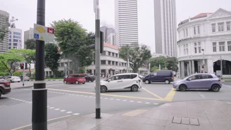 four-way-traffic-junction-in-slow-motion-in-the-city-with-cars-turning-along-the-road