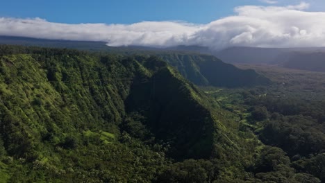 Panoramic-aerial-overview-of-hidden-waterfall-in-valley-on-North-shore-of-Maui