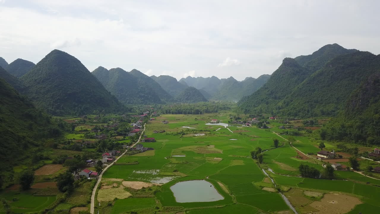 Lush green Bac Son Valley with mountains, serene and remote aerial view