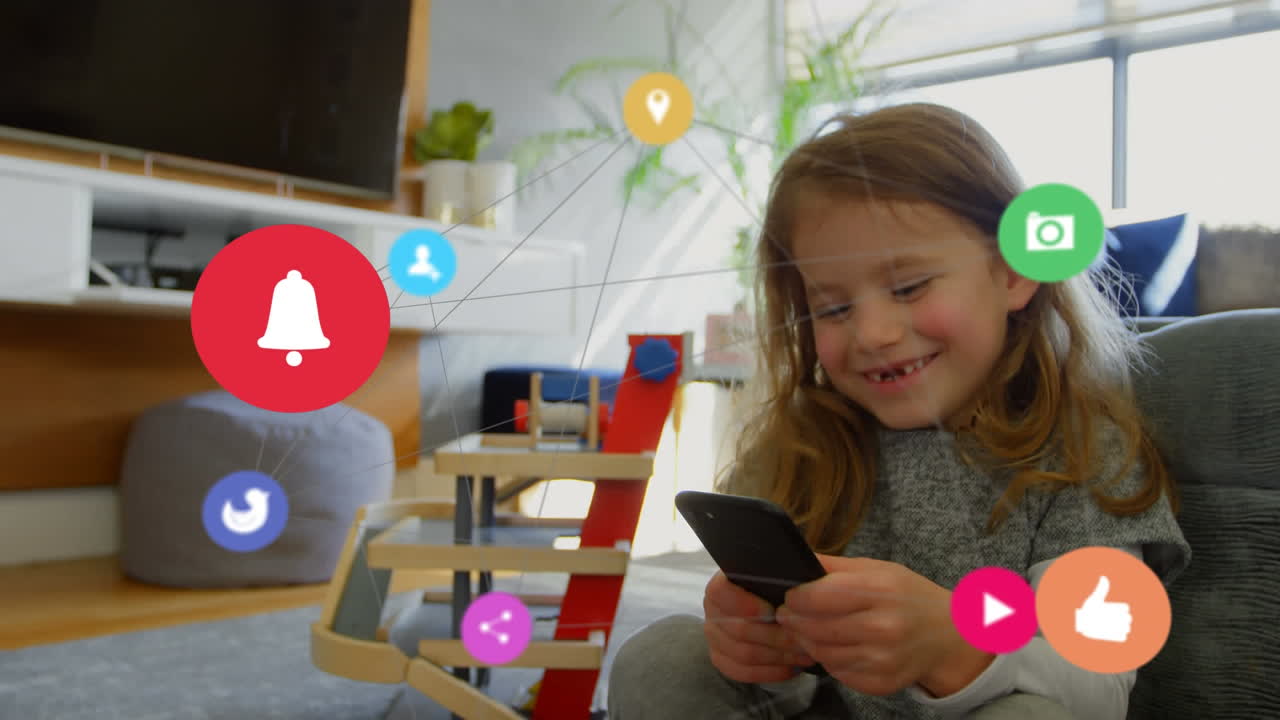 iconos de las redes sociales que se mueven contra la niña usando un teléfono inteligente