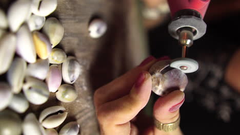 close up gimbal shot of female hands shaping seashell