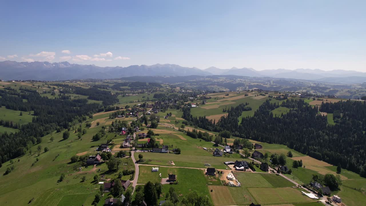 Green Hills and Majestic Tatra Peaks in Summer, Poland Aerial View
