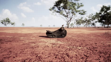 Old-decorated-mexican-saddle-lying-on-sand