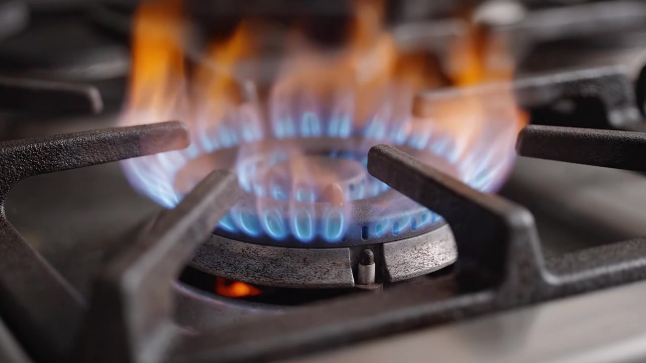 A Dynamic Visual Journey Through a Gas Stove: Capturing the Transformation from Idle Burner to a Vibrant Blue Flame of Culinary Potential