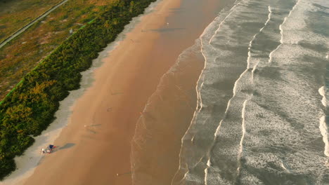 Aerial-footage-of-a-tropical-beach-with-waves