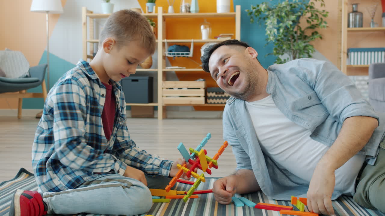 Father and Son Playing with Wooden Blocks