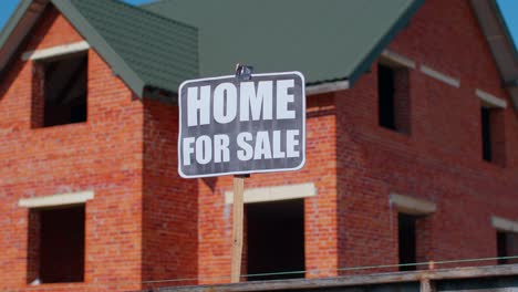 home for sale sign inscription note tag message on paper, house on background, advertising selling