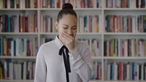 portrait beautiful young woman student yawning looking sleepy business intern girl tired at work wearing stylish fashion in bookshelf background