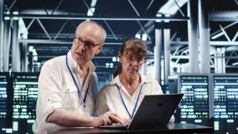 Colleagues crosschecking server parts