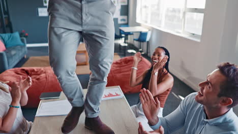 Businessman,-dancing-and-table-with-happy-team