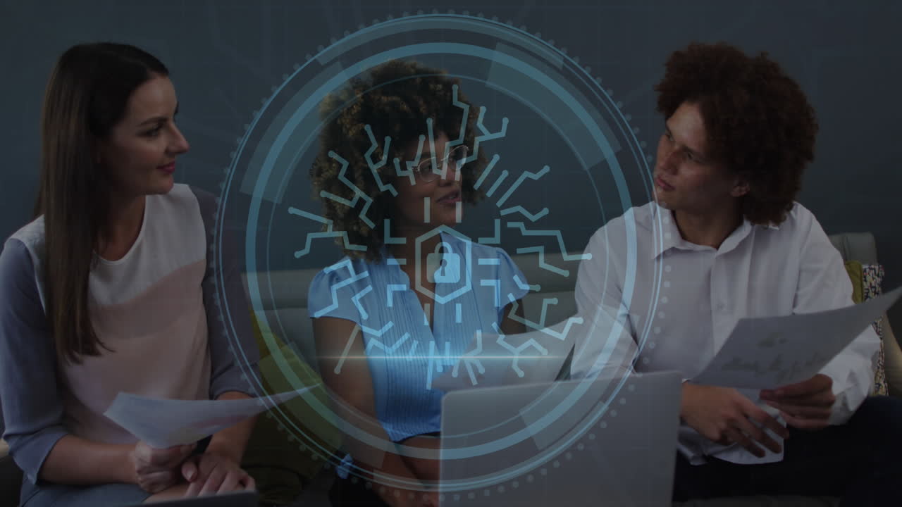 Animation of cyber security text, security padlock icon over diverse colleagues discussing at office