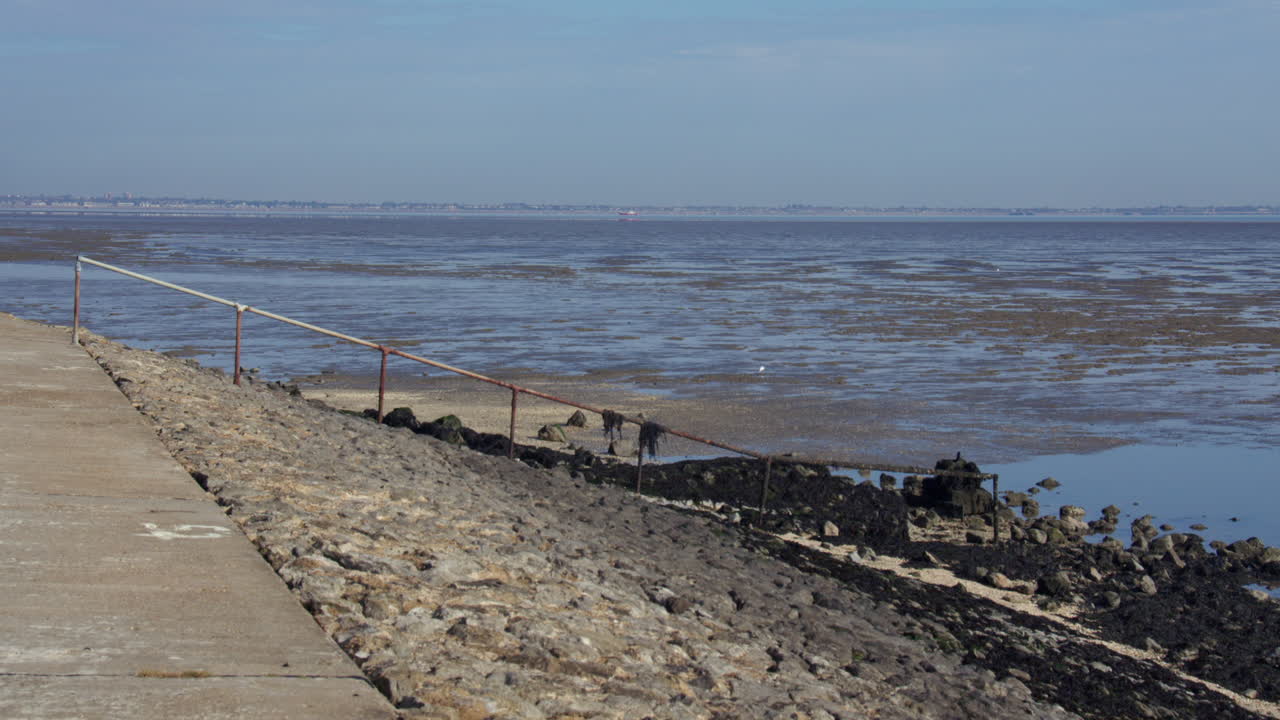 Wide shot looking out of the river Medway onto the Thames estuary with Shoeburyness in background